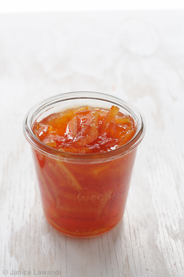 three fruit marmalade | kitchen heals soul a jar of deep orange homemade 3 fruit marmalade with longs strips of citrus peel: orange, lemon, and grapefruit