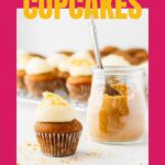 Apple cupcakes topped with cream cheese frosting and sprinkled with graham cracker crumbs.