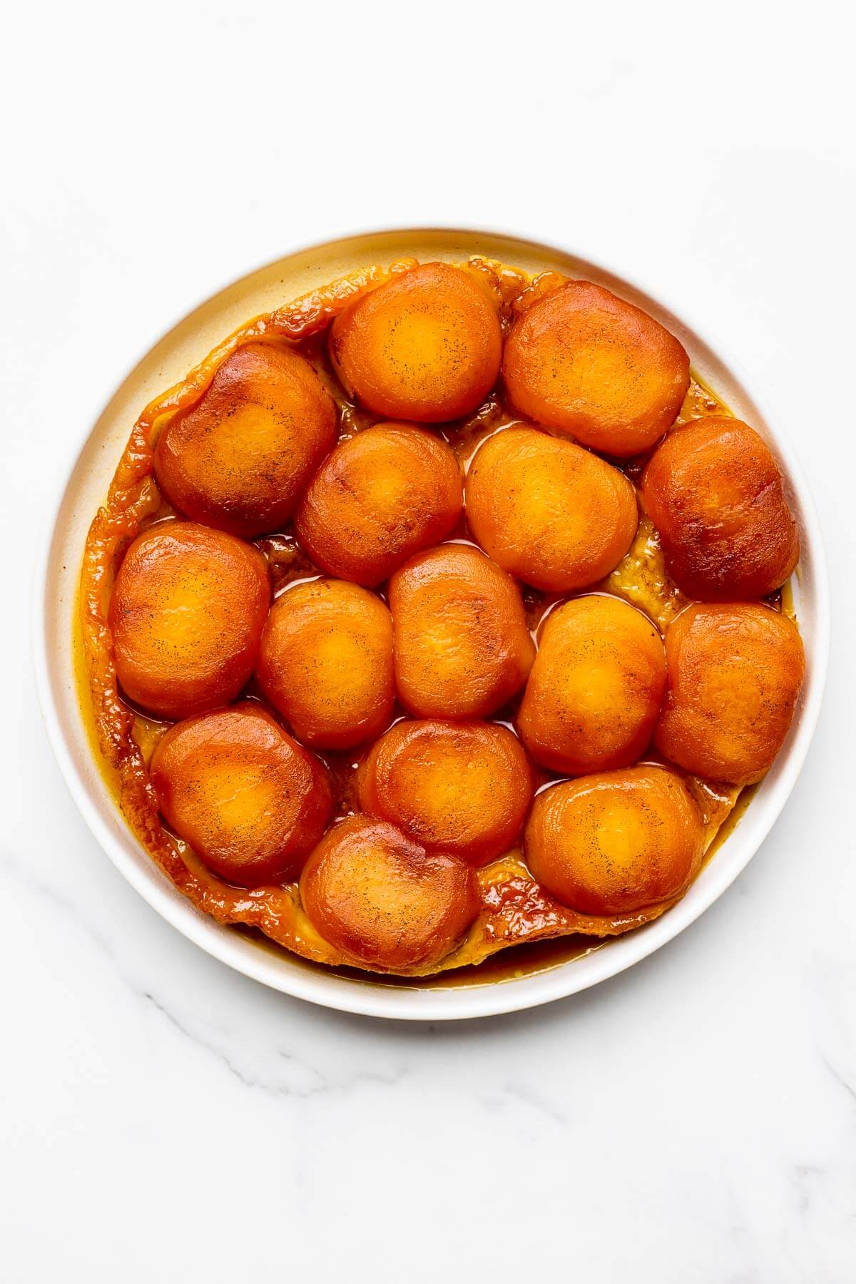 Apple tarte tatin on a white plate made with Honeycrisp apples.
