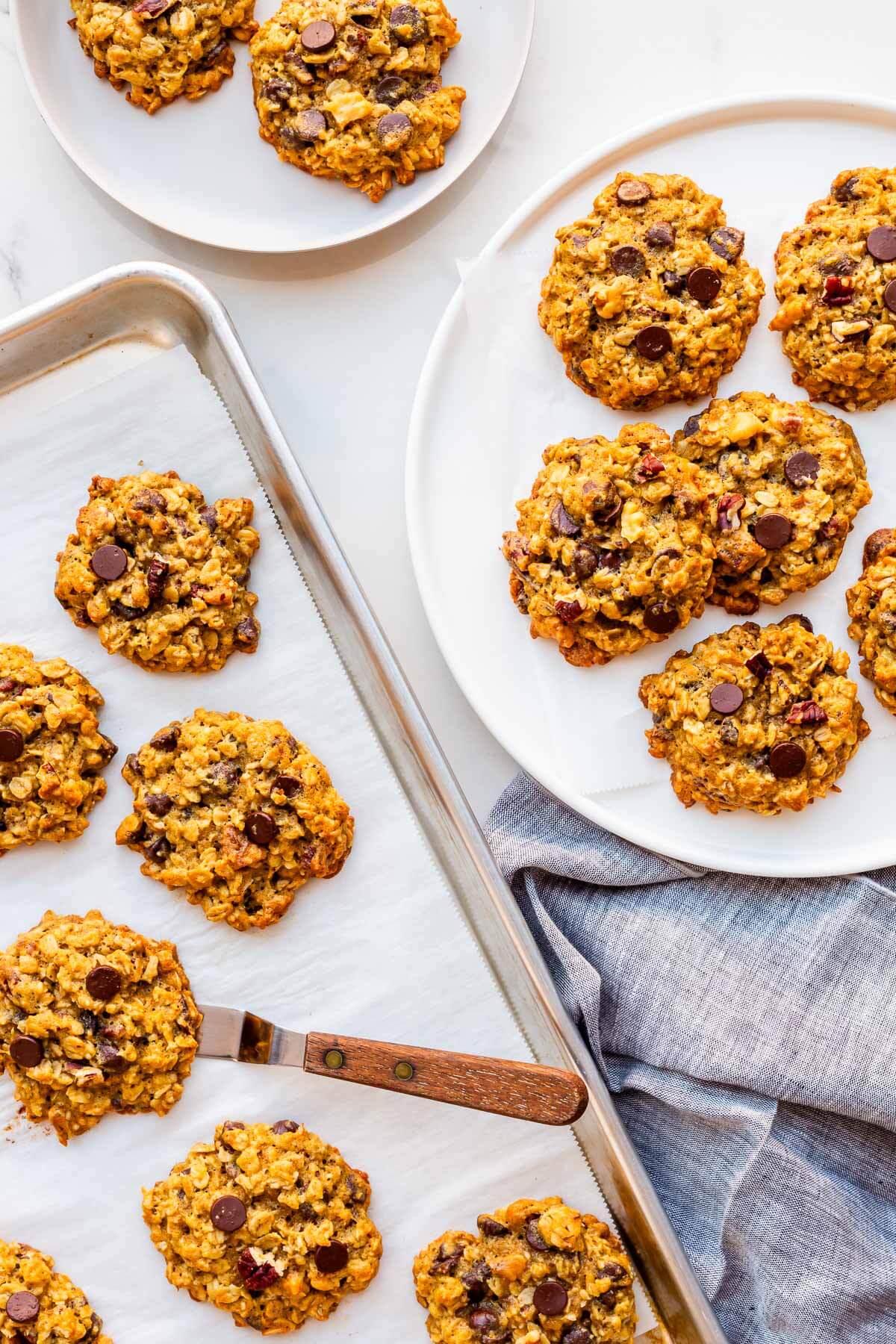 Serving freshly baked chocolate chip banana cookies with oats on a plate.