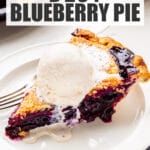 A slice of blueberry pie served à la mode with a scoop of vanilla ice cream on top, melting slowly.
