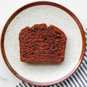 A slice of double chocolate banana bread on a plate.