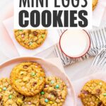 Pink plates of Easter cookies garnished with Mini Eggs served with a glass of milk.