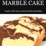 Slices of chocolate and vanilla marble loaf cake arranged on a white platter