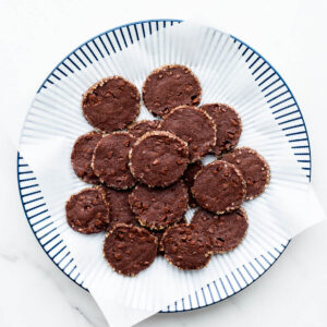 A plate of double chocolate cookies with a crunchy sugar edge.