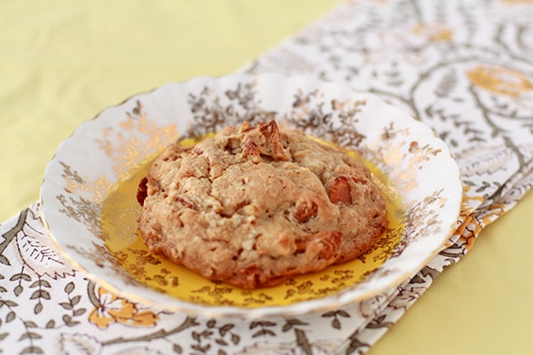 Bacon whiskey apple cookies Thick bacon apple oat cookie on a fancy plate with floral napkin