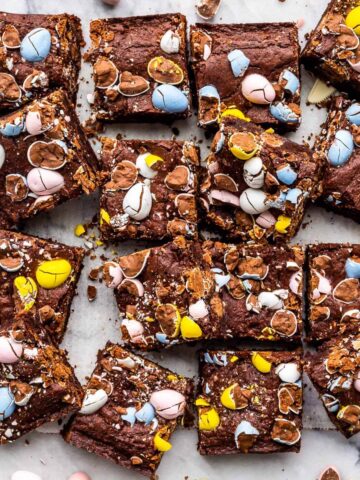 Brownies decorated with Easter eggs cut into squares to serve.