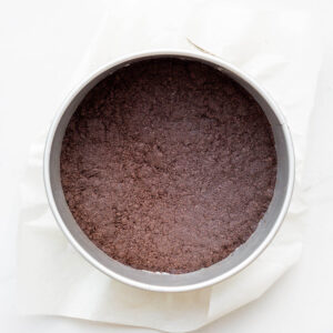Oreo cookie crust baked in a springform pan for cheesecakes.