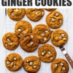 Freshly baked ginger cookies on a cooling rack.