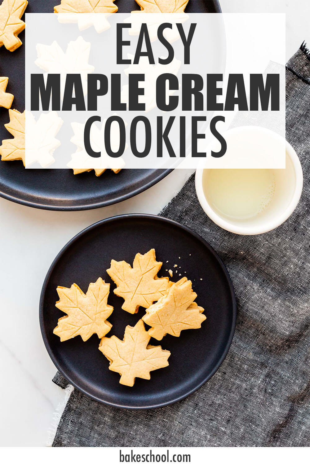 A plate of maple cream cookies with a glass of milk.