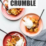 Warm rhubarb crisp in pink bowls served with vanilla ice cream.