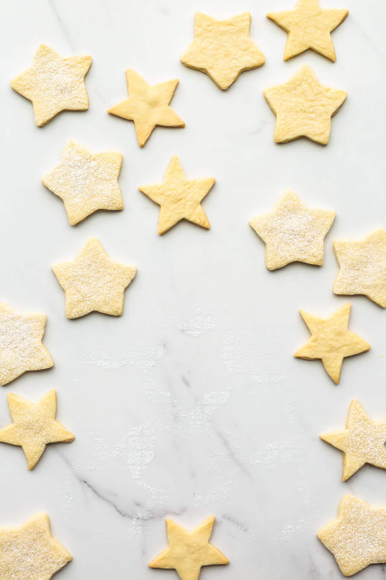 Shortbread stars on marble surface.