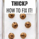 Very thick cookies that didn't spread enough, on a parchment-lined sheet pan.