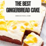 Cream cheese frosted gingerbread cake cut into squares on a marble surface.