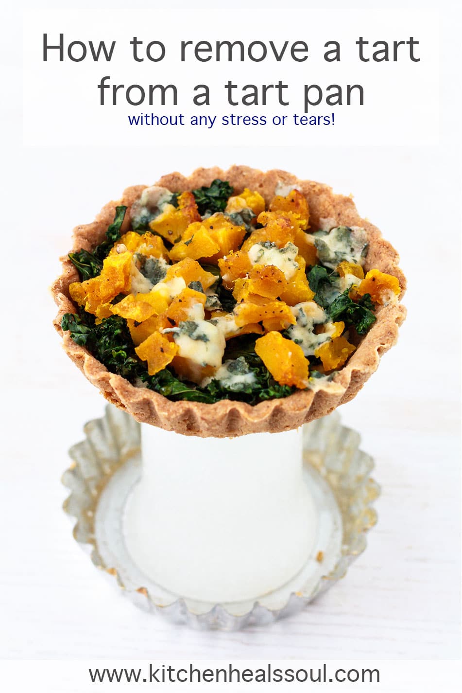 Removing a tart from a tart pan with a removable bottom by placing it over a glass to unmold it from the tart ring