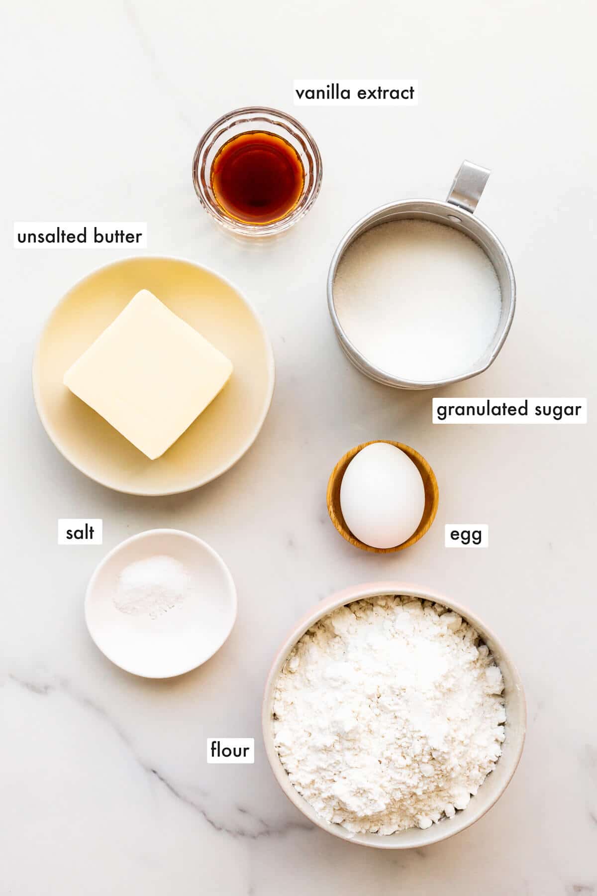 Ingredients to make rolled sugar cookie cutouts.