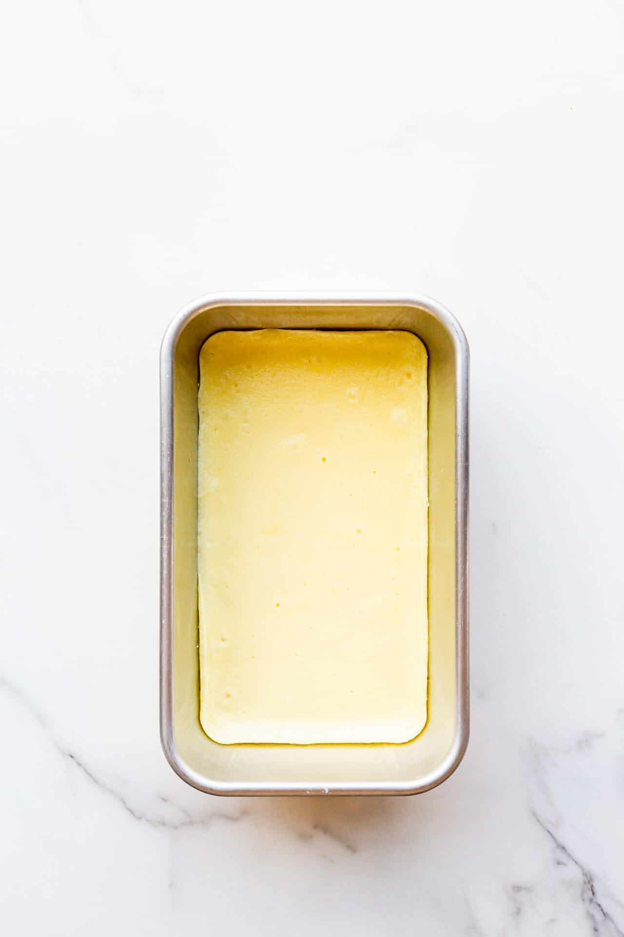 Liquid cheesecake filling baked in a metal loaf pan to set it so that it's thick enough to fill pies and cakes.