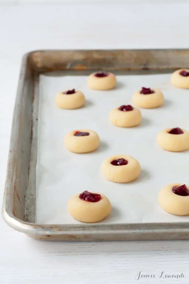 Making jam thumbprint cookies