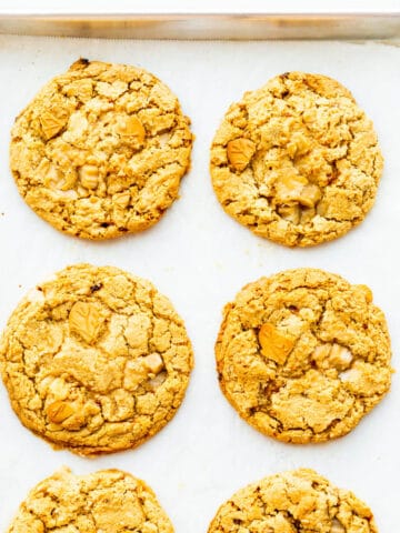 Maple cookies cooling on a sheet pan.