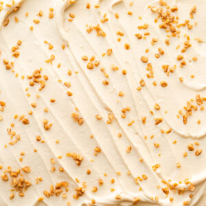 Swirls of maple-flavoured whipped cream with maple flakes sprinkled on top.