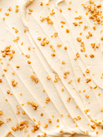 Swirls of maple-flavoured whipped cream with maple flakes sprinkled on top.