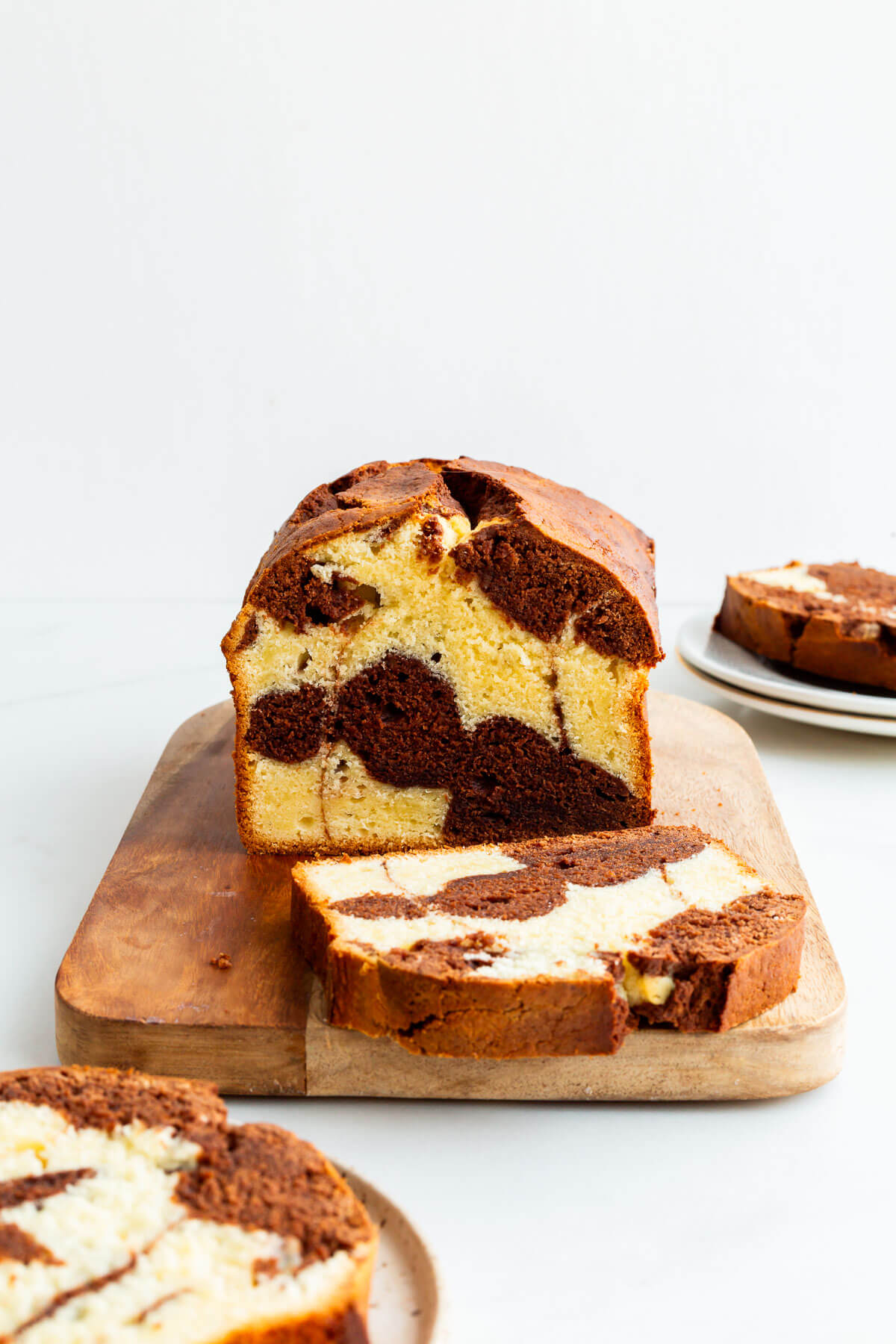 Slicing and serving a marble cake.