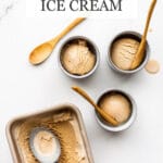 Masala chai ice cream frozen in a loaf pan and being scooped into little blue cups and served with wooden spoons