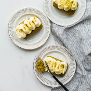 Mini matcha cakes on dessert plates.