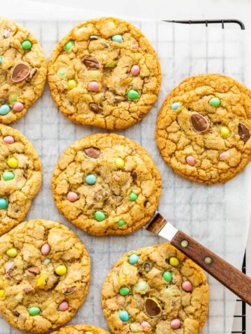 Mini Eggs cookies cooling on a wire rack.