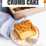 Serving apple crumb cake on speckled ceramic plates.