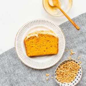 A slice of maple pumpkin bread on a dessert plate.
