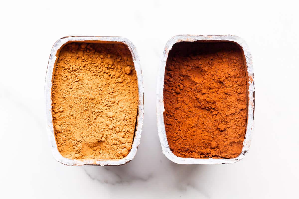 Natural next to extra dark Hershey's cocoa powder to show the difference incolour.