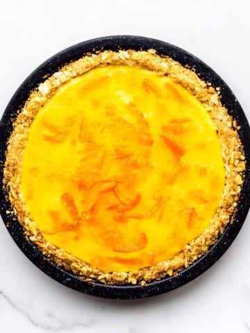 Orange pie with saltine crust and topped with orange marmalade glaze.