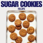 A sheet pan of molasses sugar cookies coated in coarse turbinado sugar.