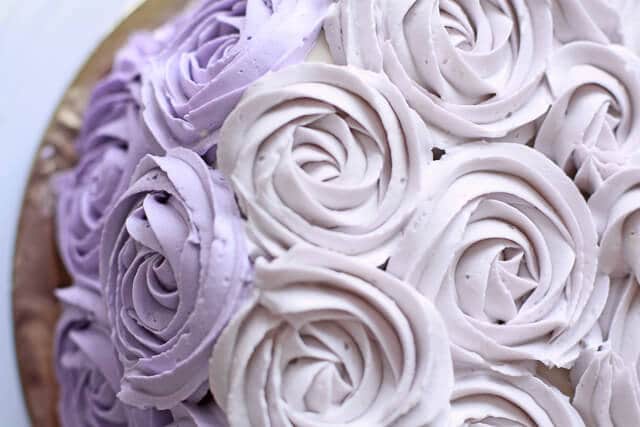 Piped Italian meringue buttercream to make a rose cake