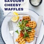 A plate with a savoury cheese waffle topped with greens.