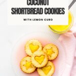 A plate of lemon linzer cookies ready to be eaten.