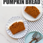 Slices of pumpkin bread with cream cheese frosting served on dessert plates.